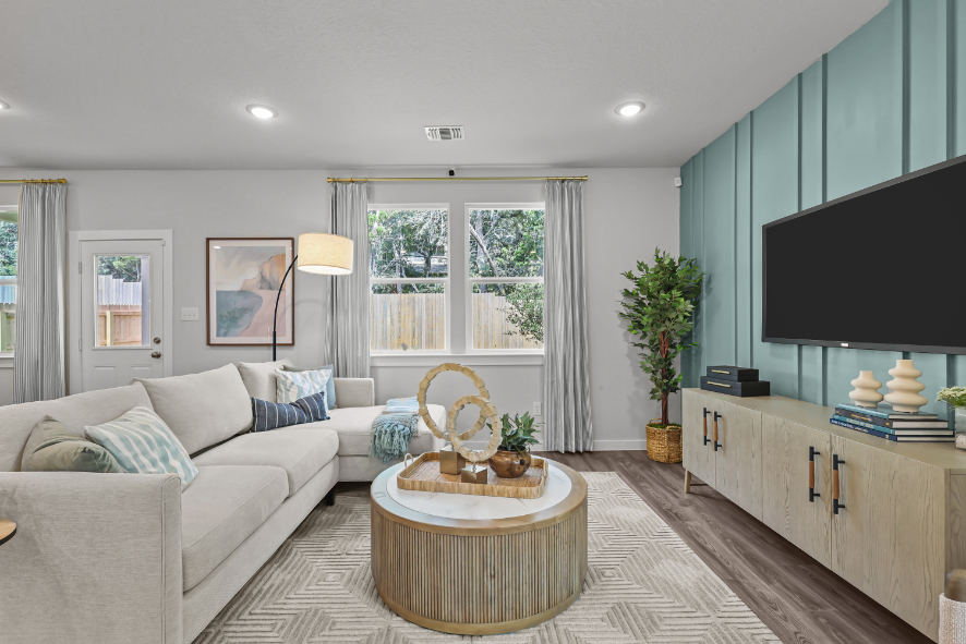 A living room with a tv and a couch.