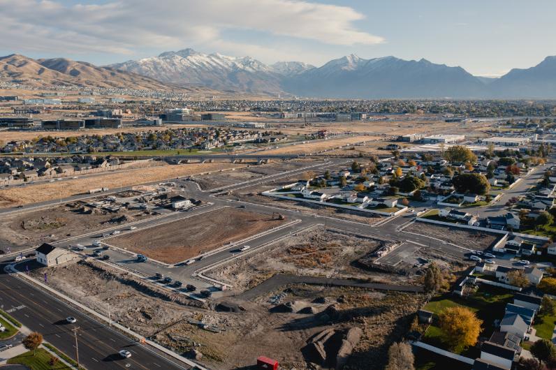 A large area with buildings and mountains in the background.
