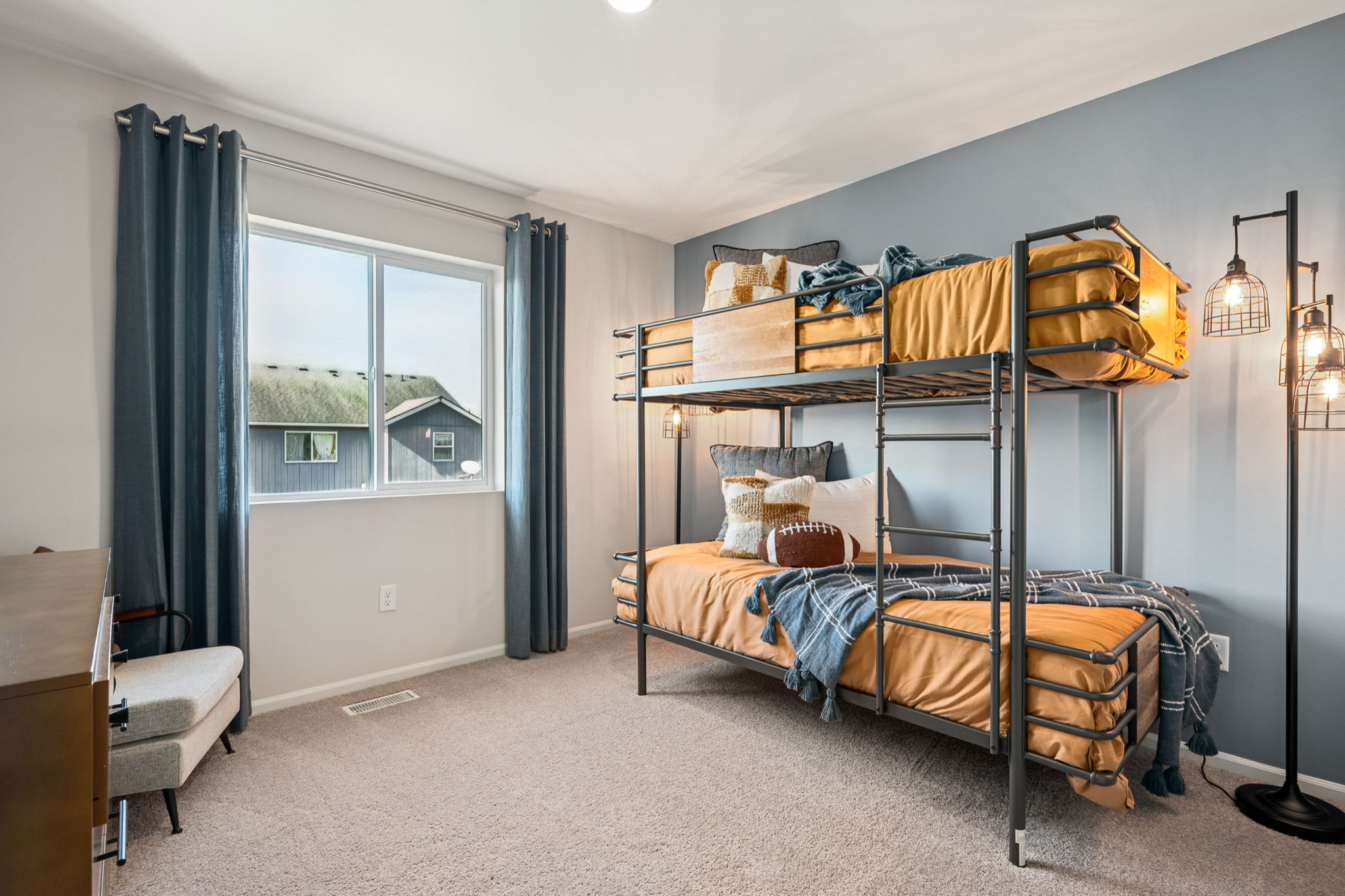 A bedroom with a bunk bed.