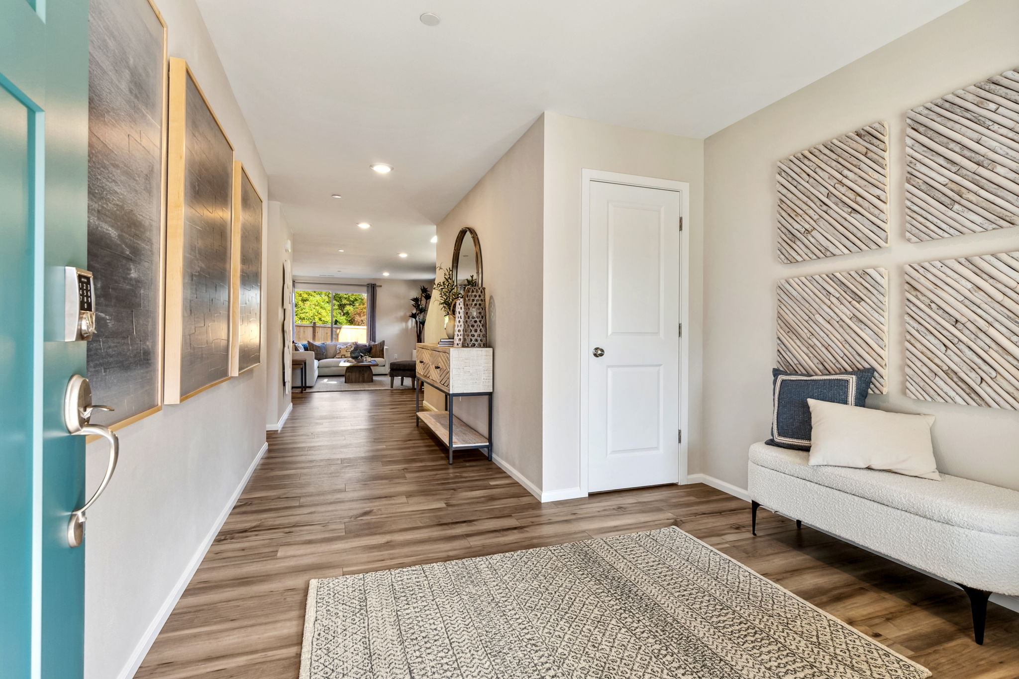 A living room with a rug.