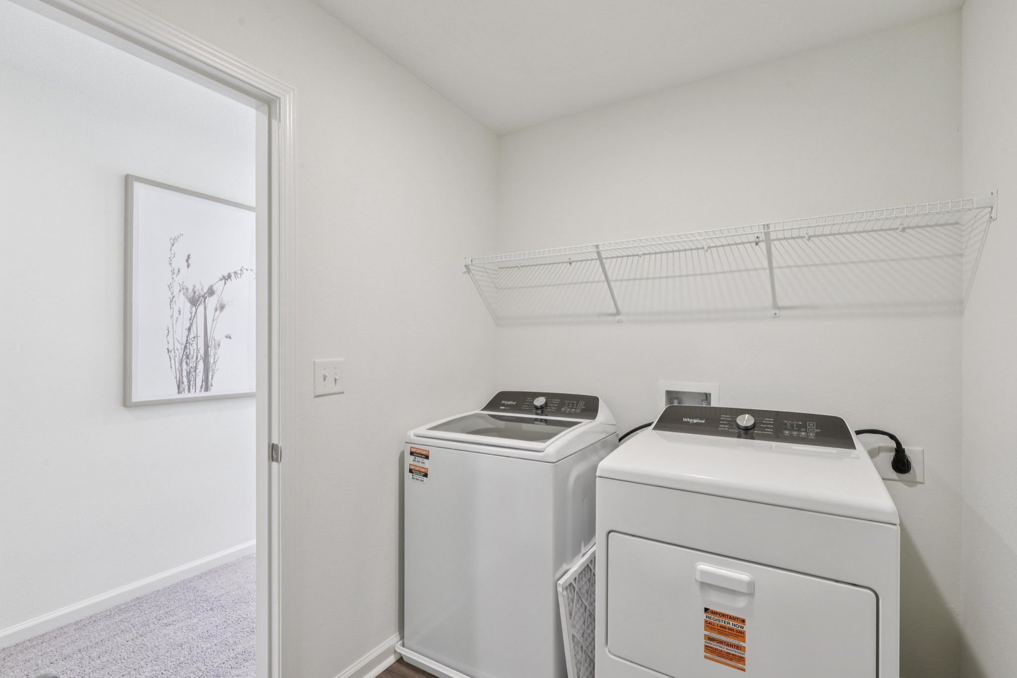 A laundry room with a washer and dryer.
