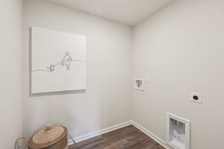 A room with a drawing on the wall.