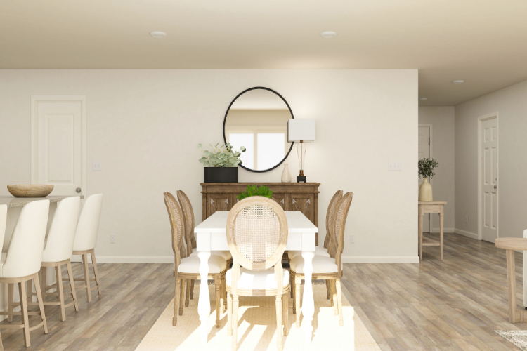 A dining room with a round table.