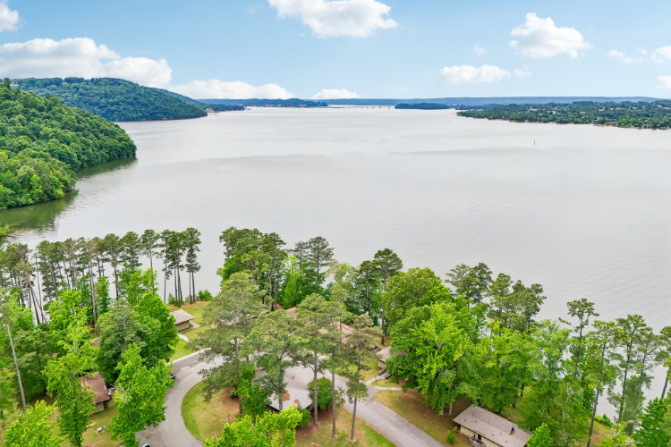 A body of water with trees around it.