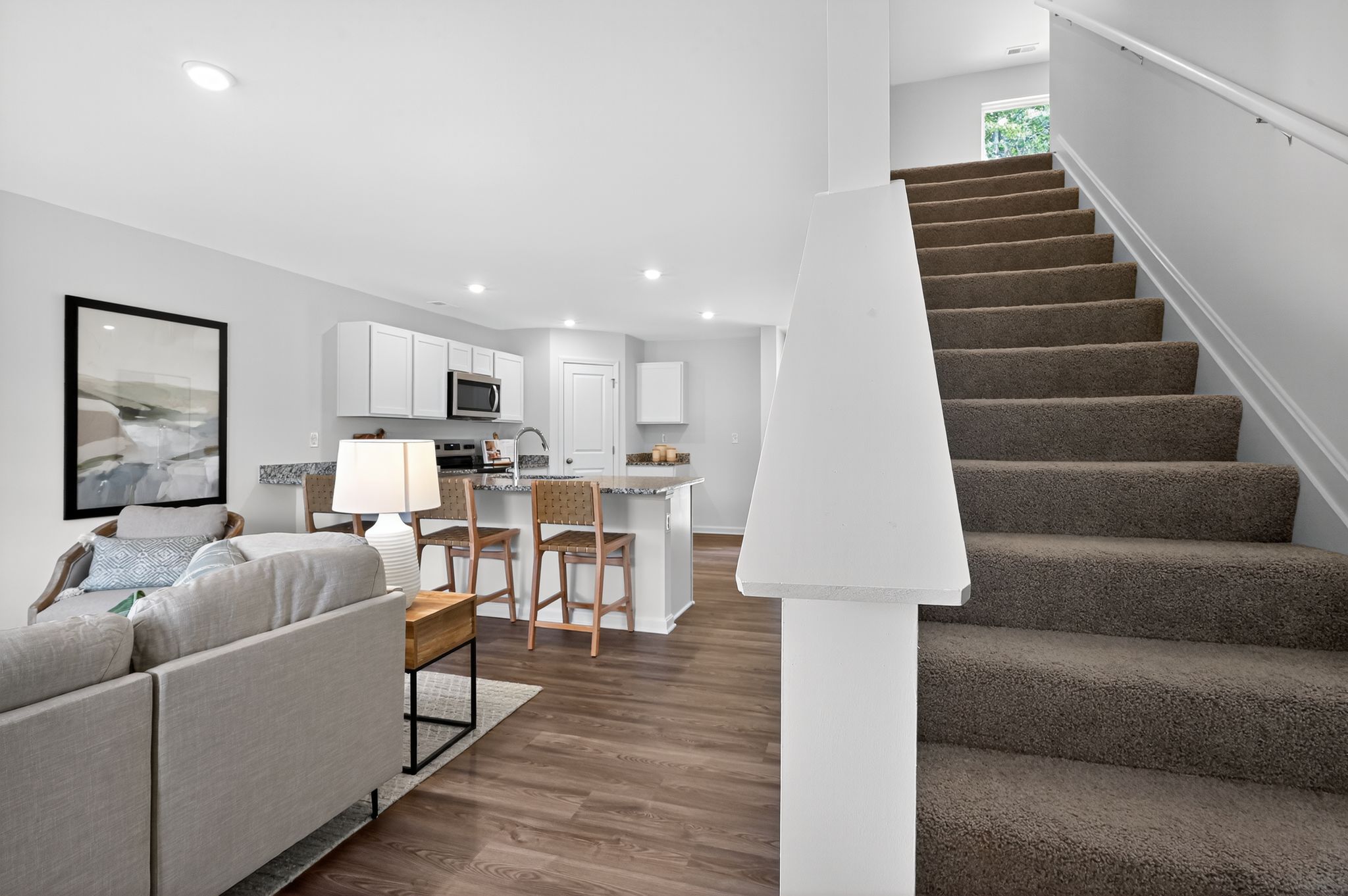 A staircase leading to a living room.