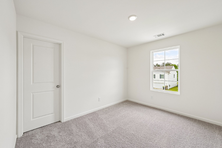 A room with a door and a window.