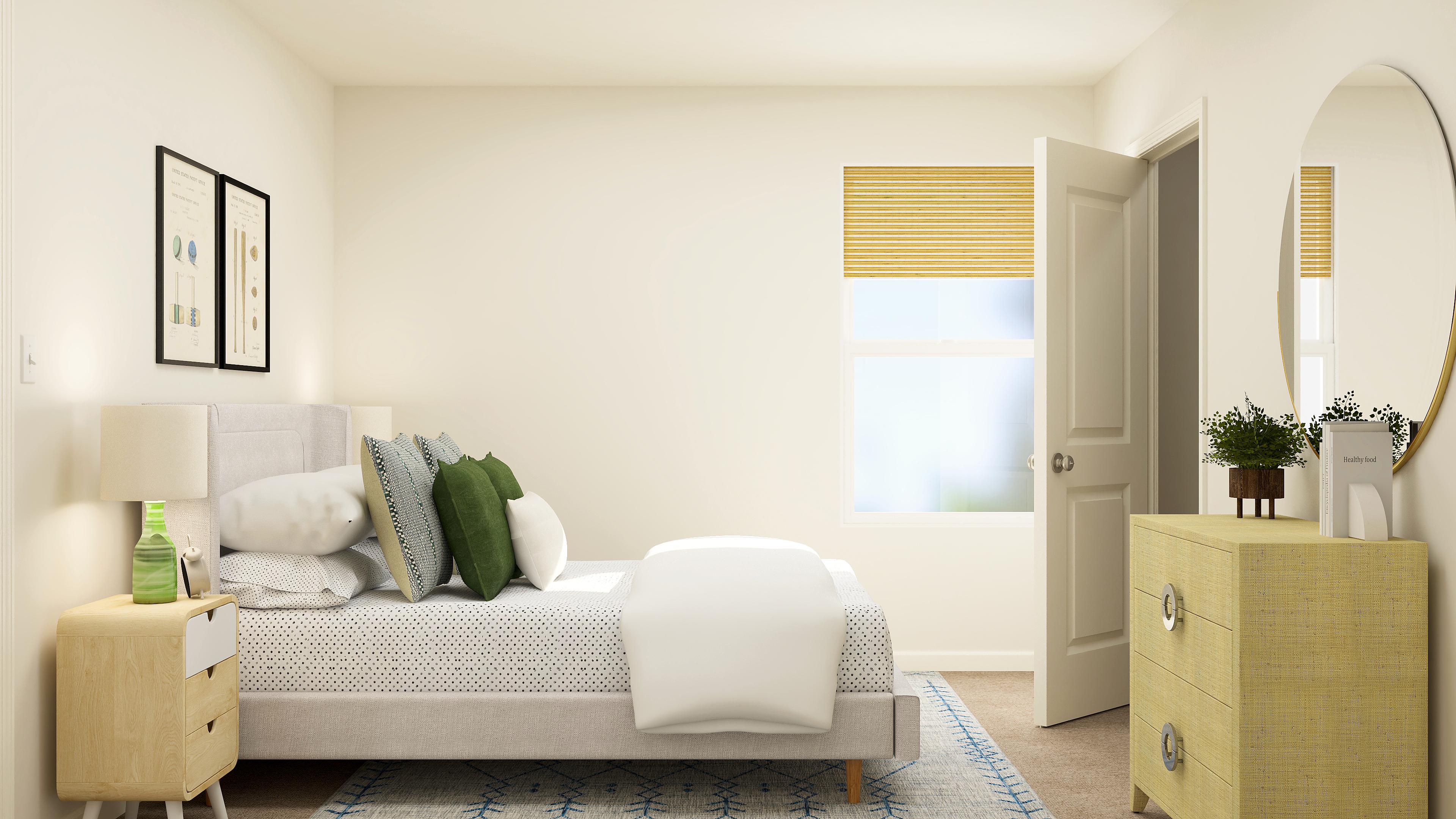 A room with a couch and a mirror.