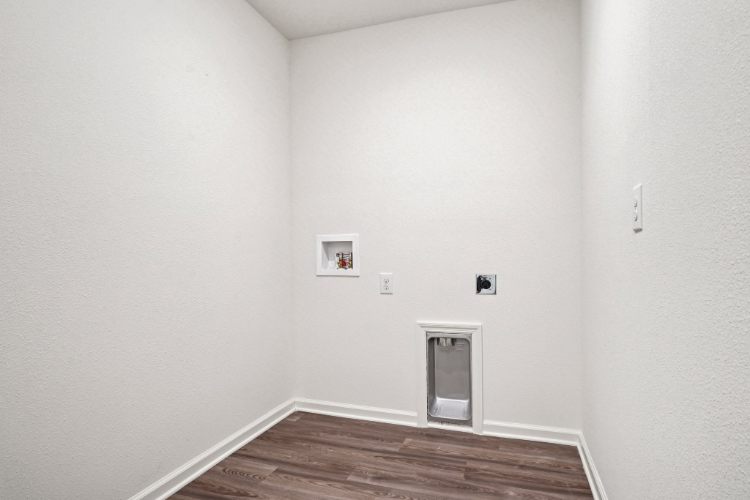 A hallway with white walls.