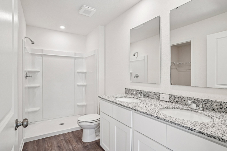 A bathroom with a marble countertop.