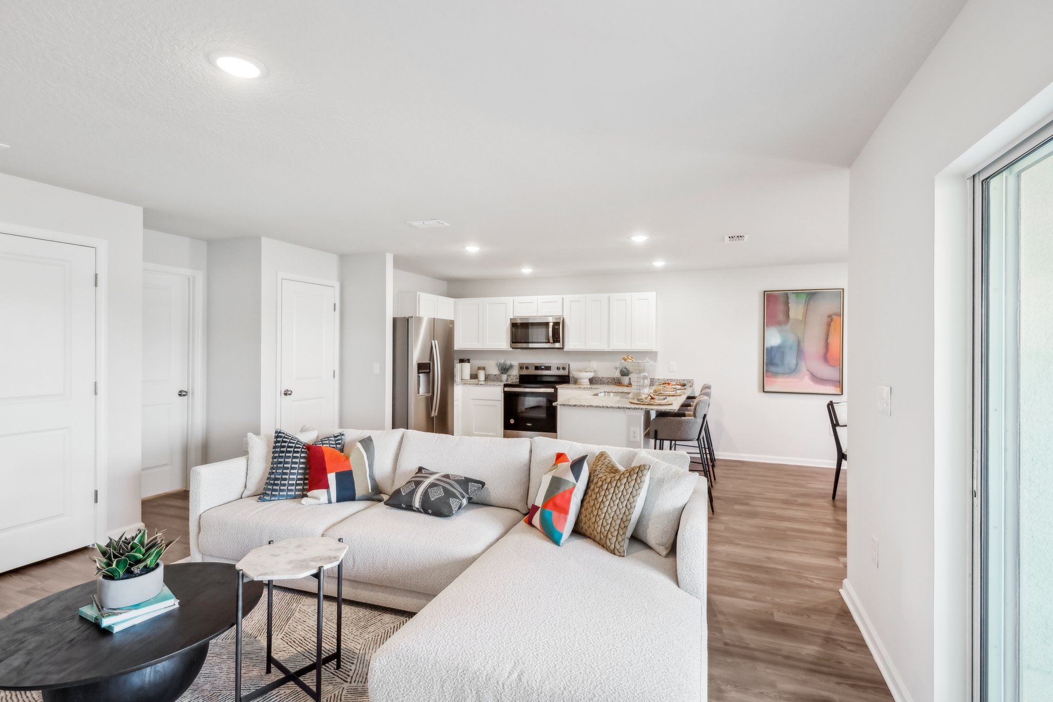A living room with a couch and a table.