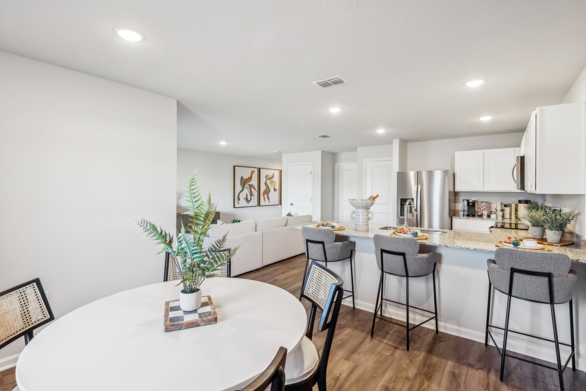 A kitchen with a dining table.