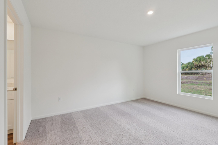 A room with a window and a door.