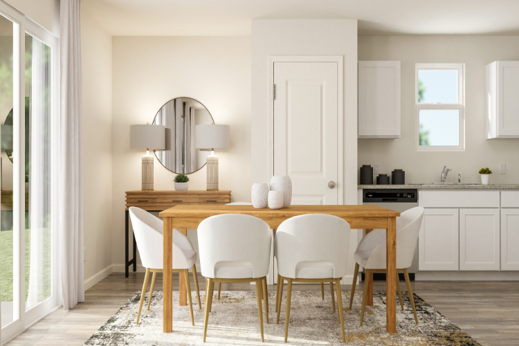 A kitchen with a dining table and chairs.