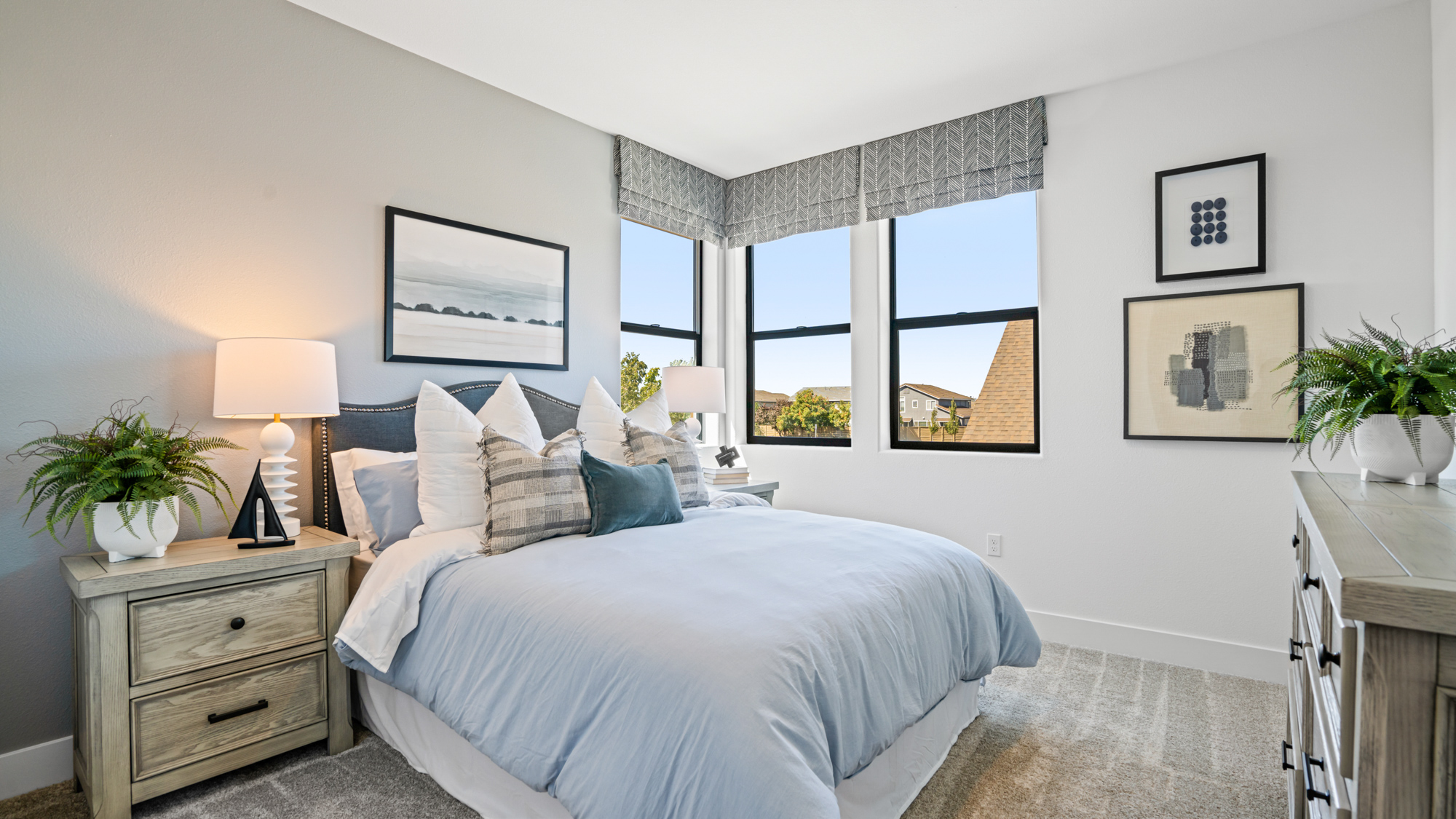 A bedroom with a bed and a window.